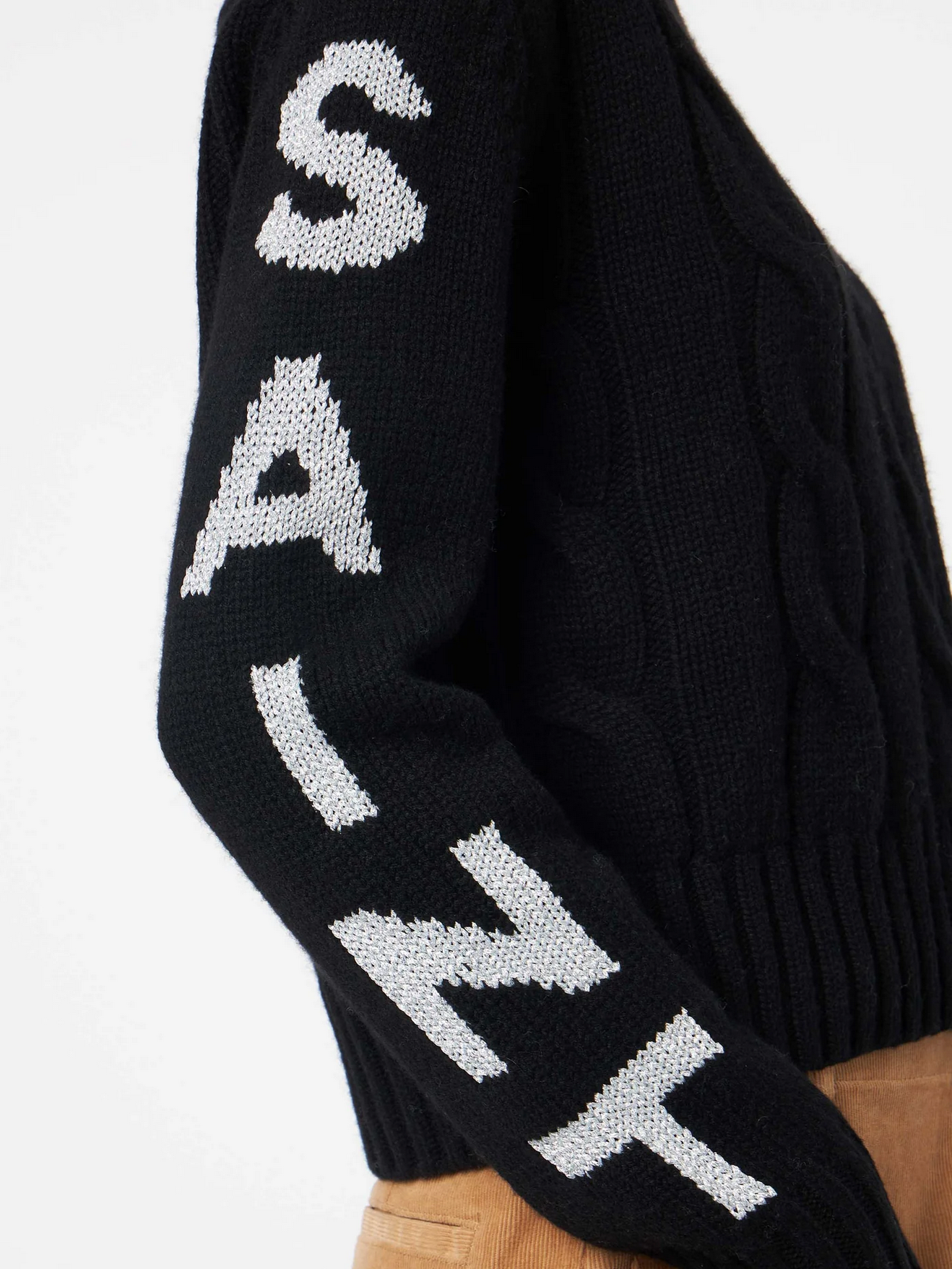 maglia nera a treccia con scritta